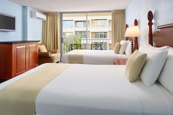 Pillowtop beds, in-room safe, desk, blackout drapes at Ewa Hotel Waikiki