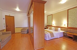 Deluxe Double Room | Living area | 32-inch LCD TV with cable channels, TV