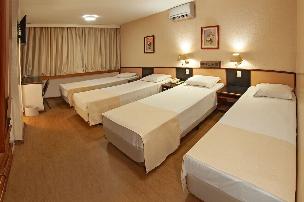 Deluxe Quadruple Room | Minibar, in-room safe, desk, free cribs/infant beds