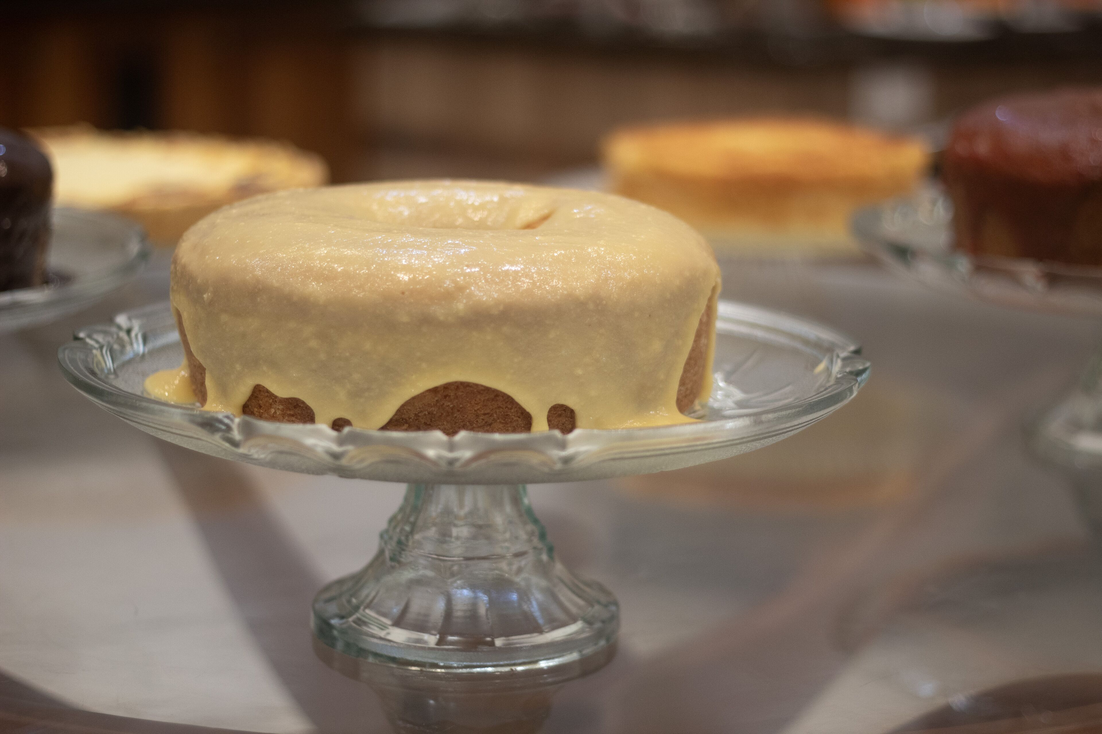A cake on a glass cake stand.