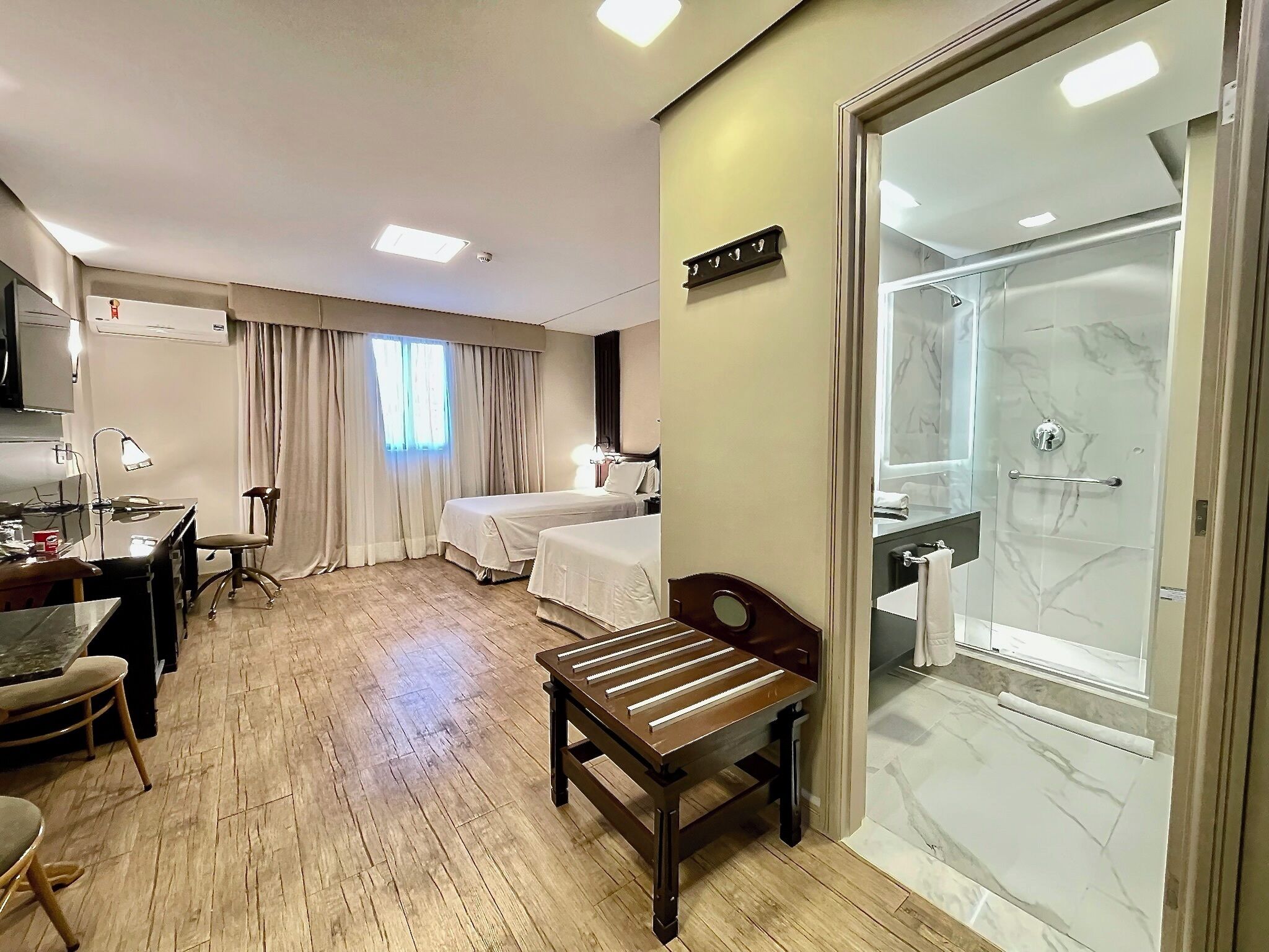 superior twin room | minibar, in-room safe, desk, laptop workspace