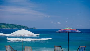 On the beach, sun-loungers, beach towels