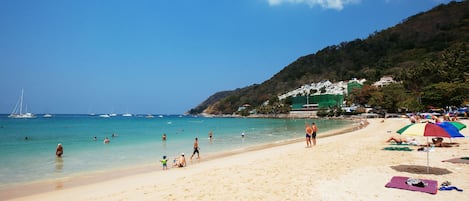 On the beach, white sand, beach towels
