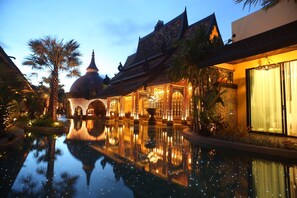A traditional building with a reflection pool, a dome structure, and ornate architectural details. - Sawasdee Village (Karon)