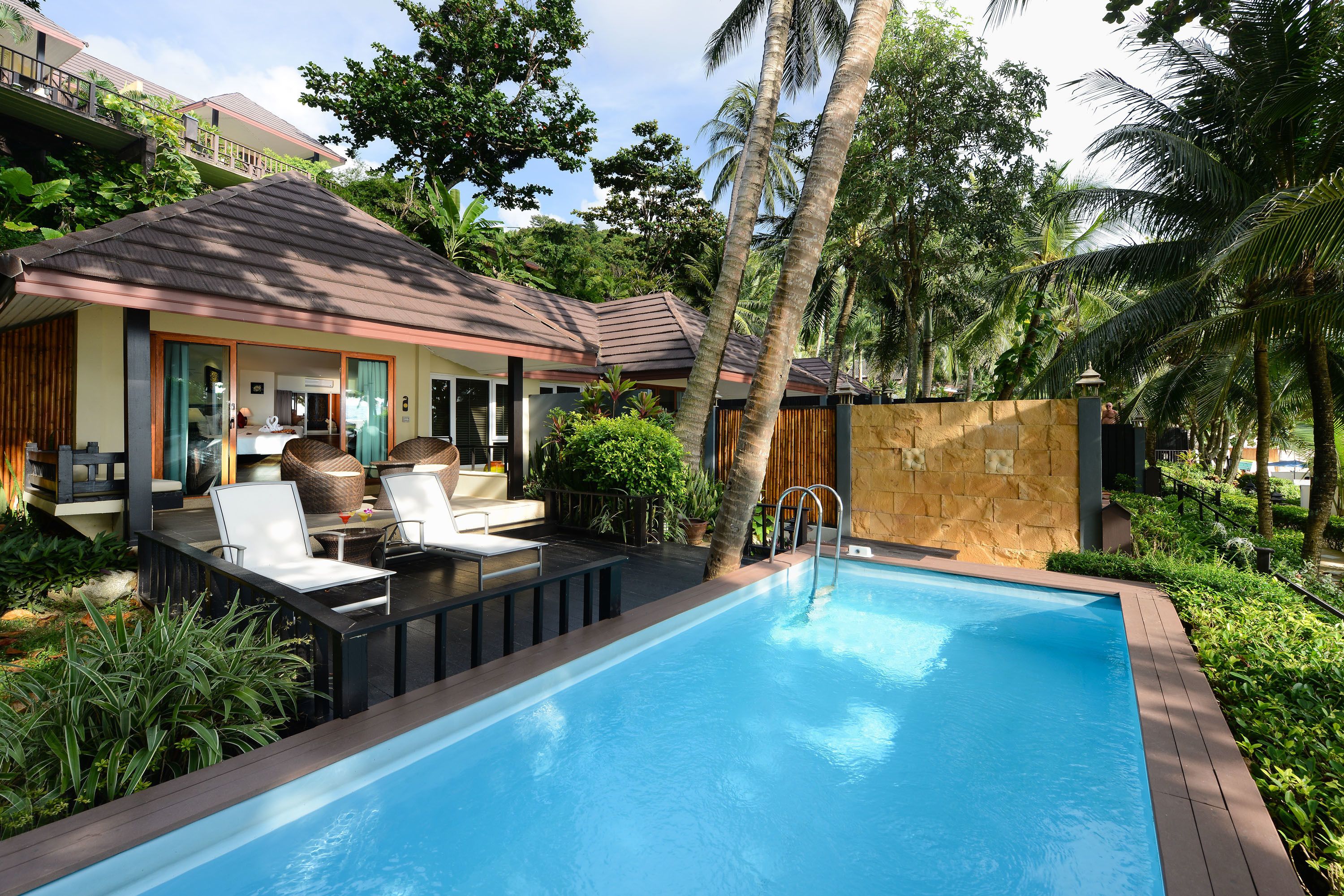 beachfront pool villa | outdoor pool | outdoor pool, pool umbrellas, pool loungers