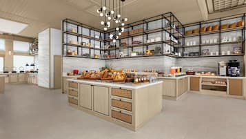 Una cocina moderna con una isla central, estantes abiertos y una variedad de utensilios de cocina y objetos decorativos.