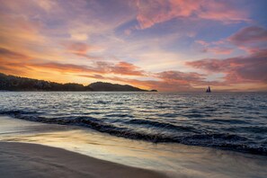 On the beach, white sand, beach towels, beach massages