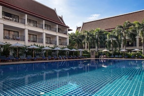 Outdoor pool, open 7:00 AM to 7:00 PM, pool umbrellas, pool loungers