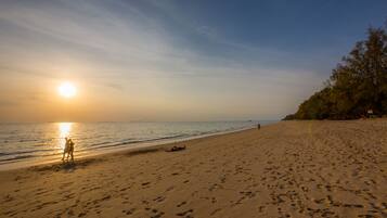 Enjoy a tranquil beach experience with calm ocean views and soft sandy shores.