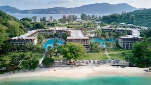 A resort with multiple buildings, a large swimming pool, and a beach. - Phuket Marriott Resort & Spa, Merlin Beach (Patong)