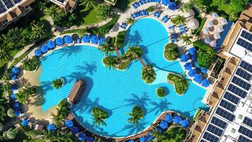 3 outdoor pools, open 8:00 AM to 9:00 PM, pool umbrellas, pool loungers