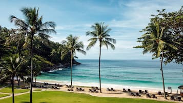 On the beach, white sand, beach umbrellas, beach towels