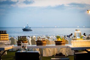 On the beach, white sand, beach umbrellas, beach towels