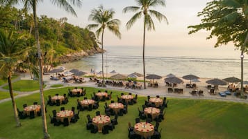 On the beach, white sand, beach umbrellas, beach towels