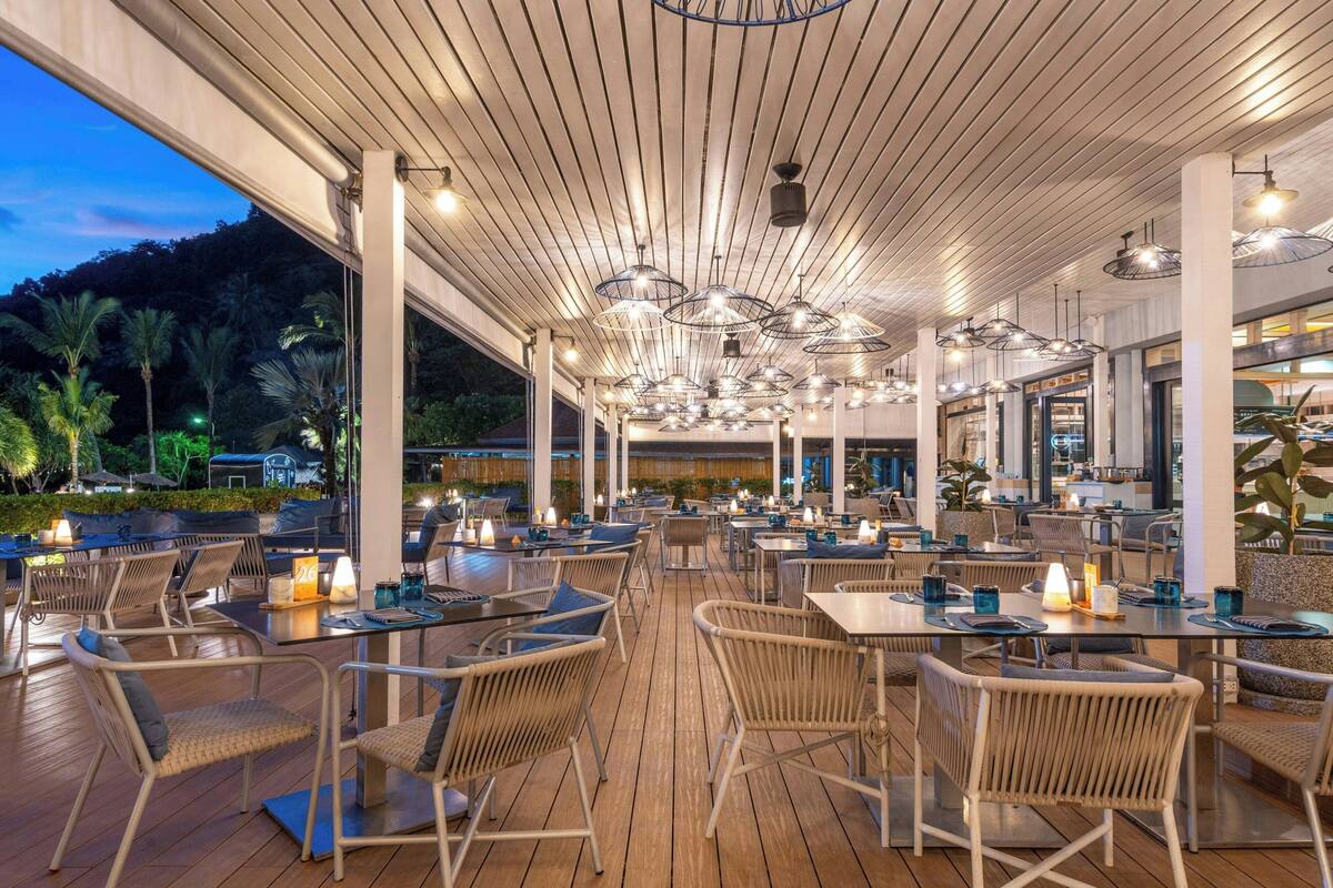 on the beach, white sand, beach umbrellas, beach towels