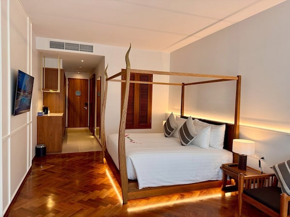Quarto superior | Frigobar, cofres nos quartos, Wi-Fi de cortesia, roupa de cama