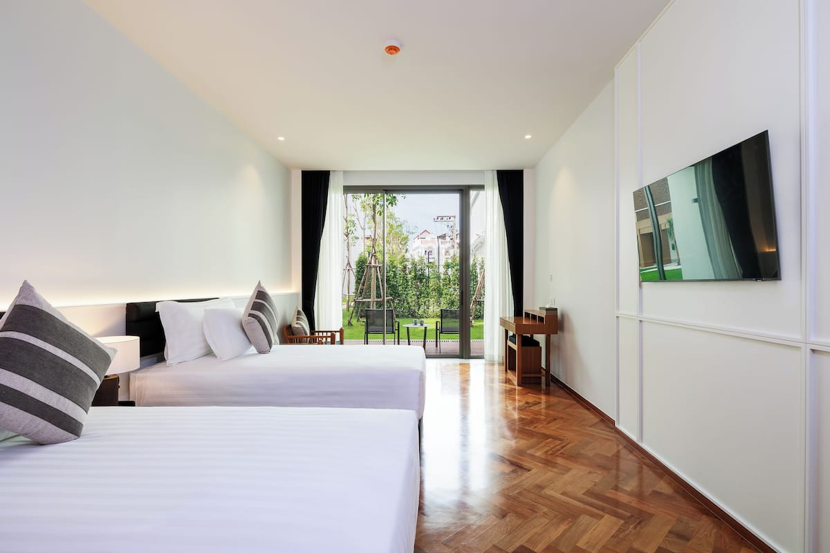 Quarto superior | Frigobar, cofres nos quartos, Wi-Fi de cortesia, roupa de cama