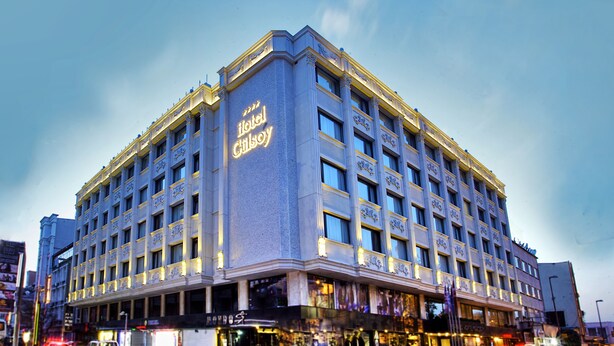 A large, multi-story hotel with a prominent sign reading "Hotel Gilson." - Grand Hotel Gulsoy (Istanbul)