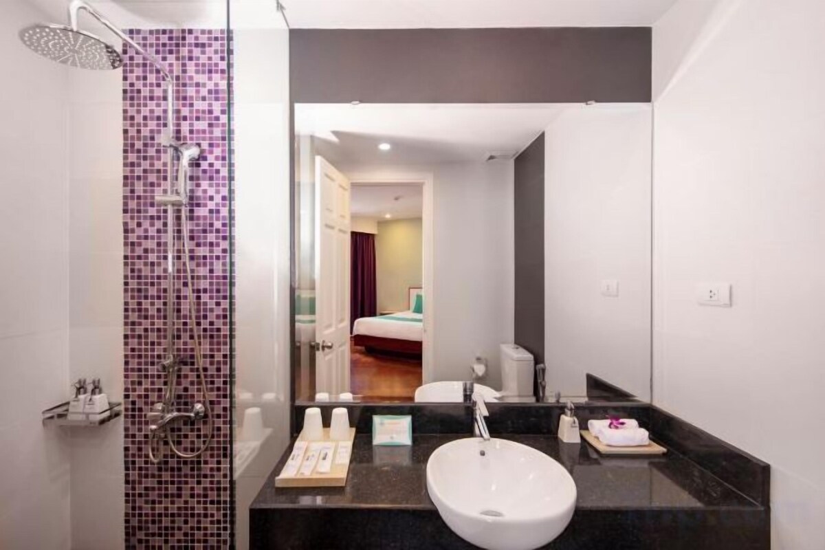 Shower, designer toiletries, hair dryer, bathrobes