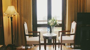 Deluxe River View, Double or Twin | Living area | Flat-screen TV - COSIANA HUE HOTEL (Hue)