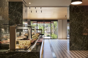 A buffet area with marble countertops and a variety of food options. - Atlantica Mikri Poli Rhodes - All Inclusive (Rhodes)