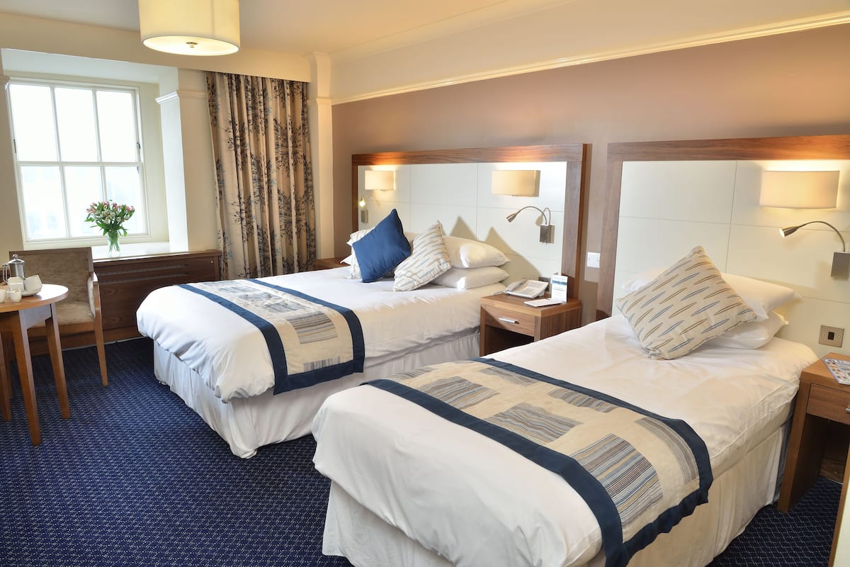 family room | hypo-allergenic bedding, desk, soundproofing, iron/ironing board