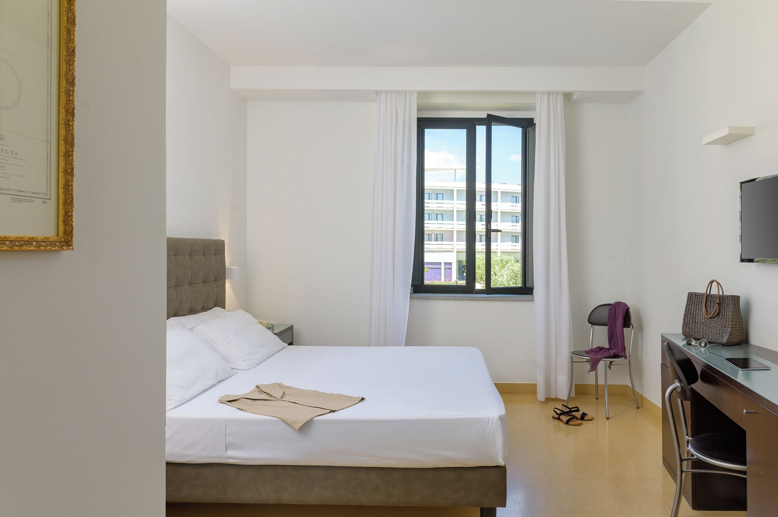 Standard Double Room | Minibar, in-room safe, desk, blackout curtains