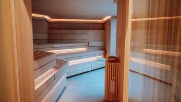 A modern spa area with wooden benches and a small wooden stool.