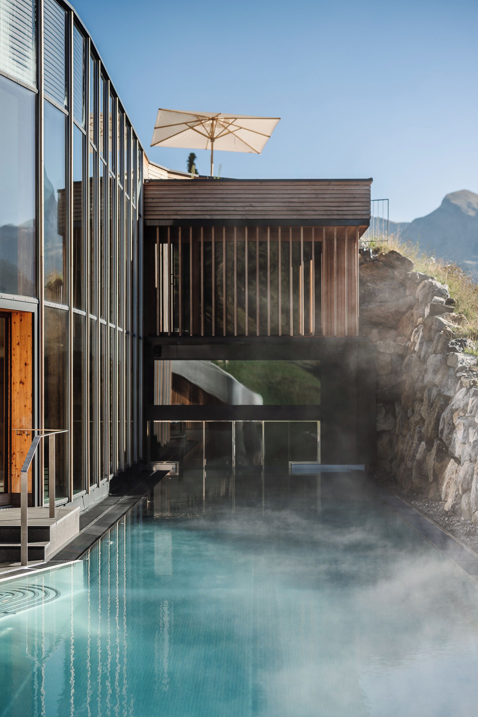 Indoor pool, outdoor pool, pool umbrellas, pool loungers