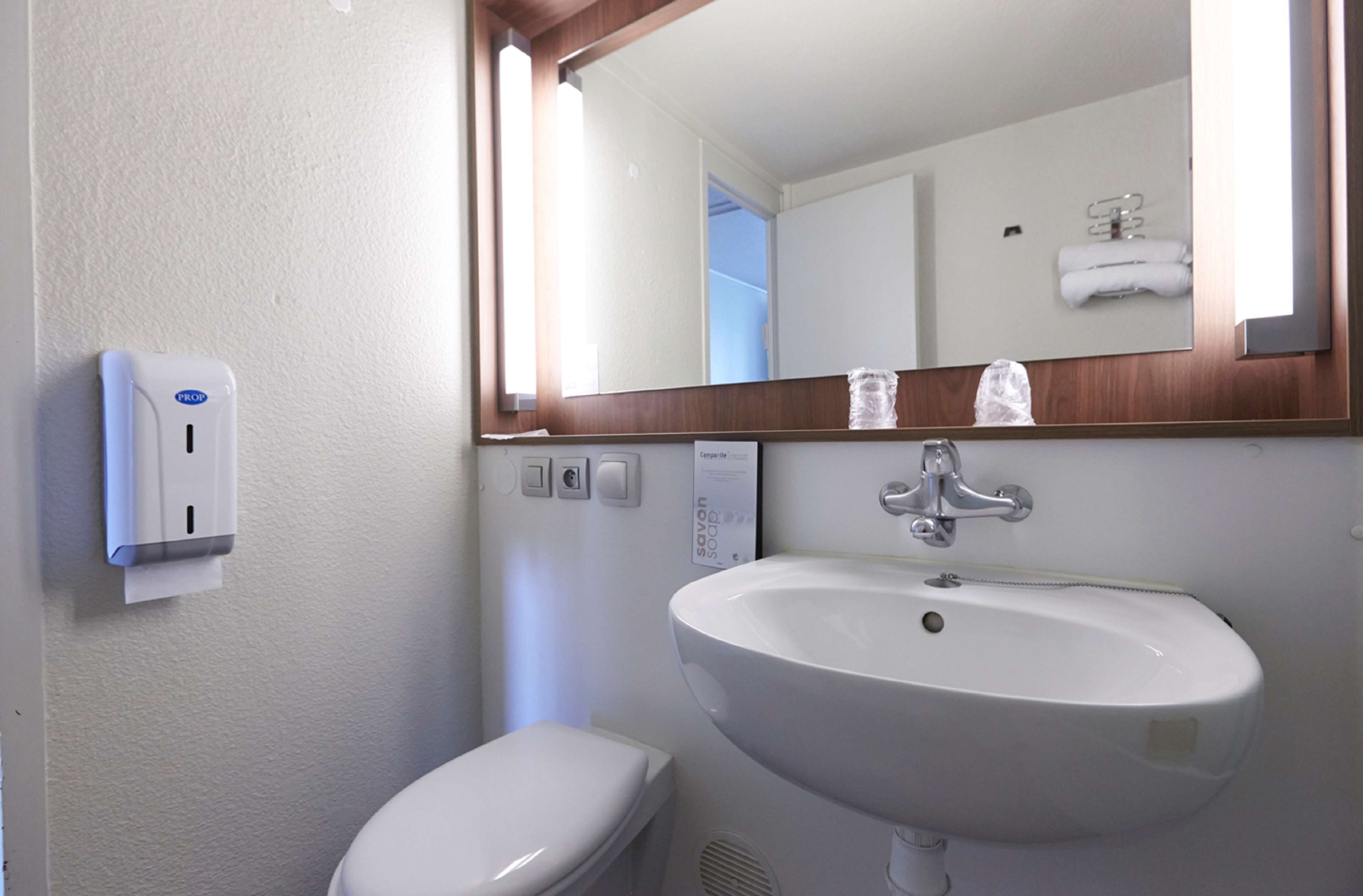 eco-friendly toiletries, towels, soap, shampoo