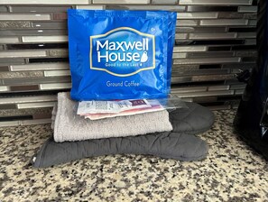 A blue bag of Maxwell House ground coffee on a kitchen counter. - Esplanade Suites, a Sundance Vacations Property (Wildwood)