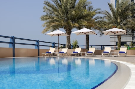 Outdoor pool, pool umbrellas, sun loungers