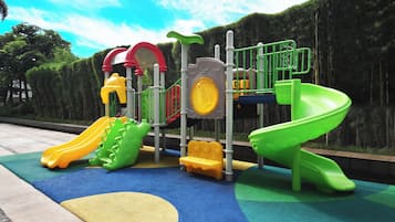 Children can play and climb in this vibrant play area with slides and climbing elements.