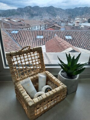 Deluxe Room, Refrigerator, City View | Bathroom sink