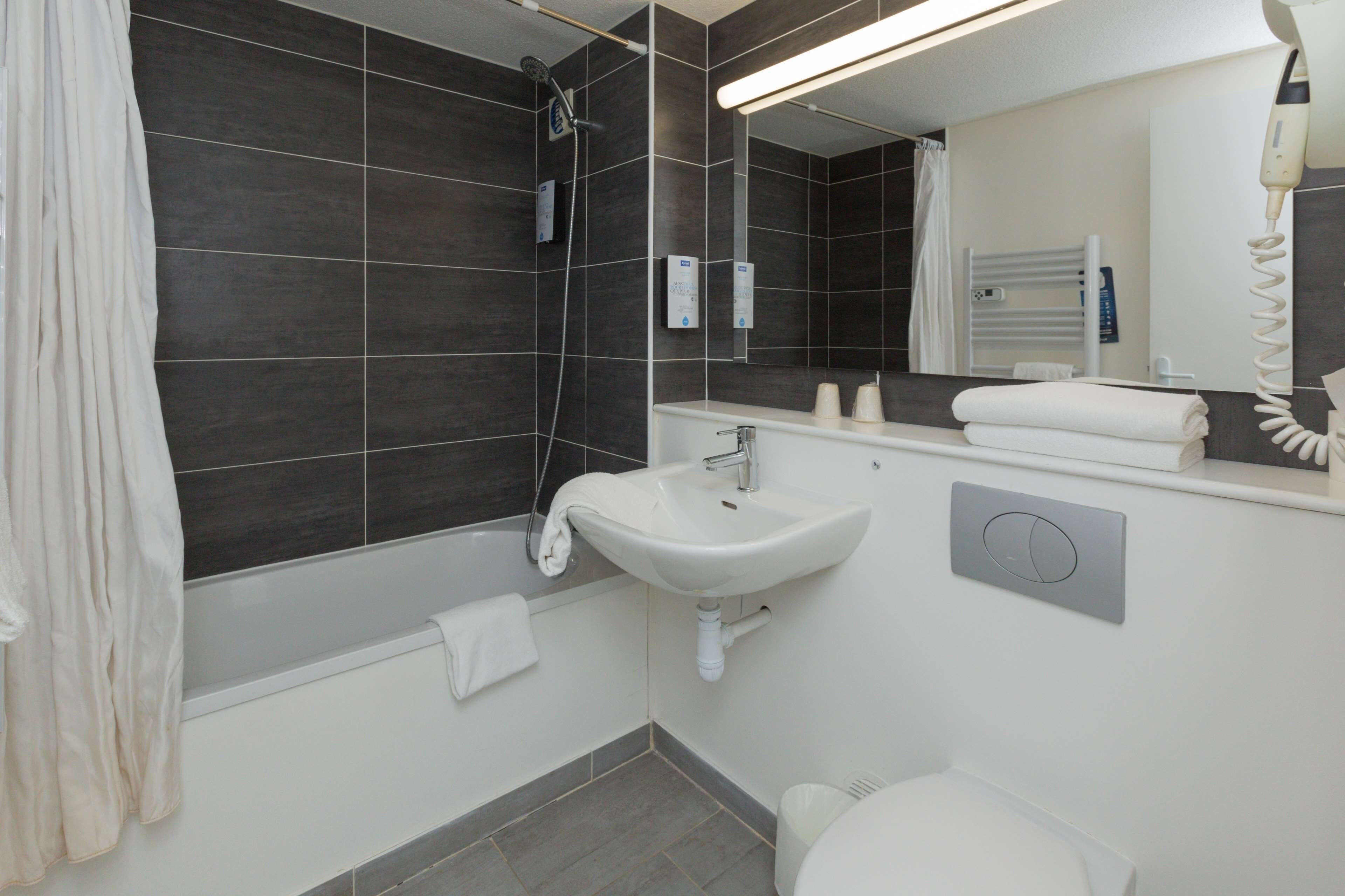 Eco-friendly toiletries, hair dryer, towels, soap