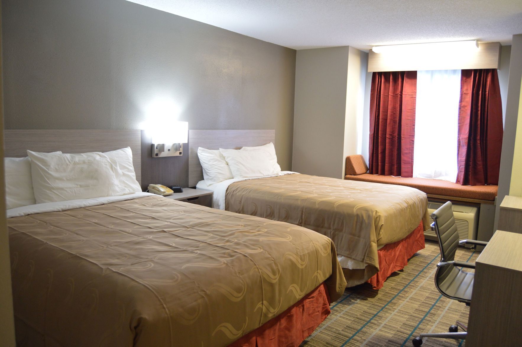 Pillow-top beds, desk, blackout curtains, soundproofing