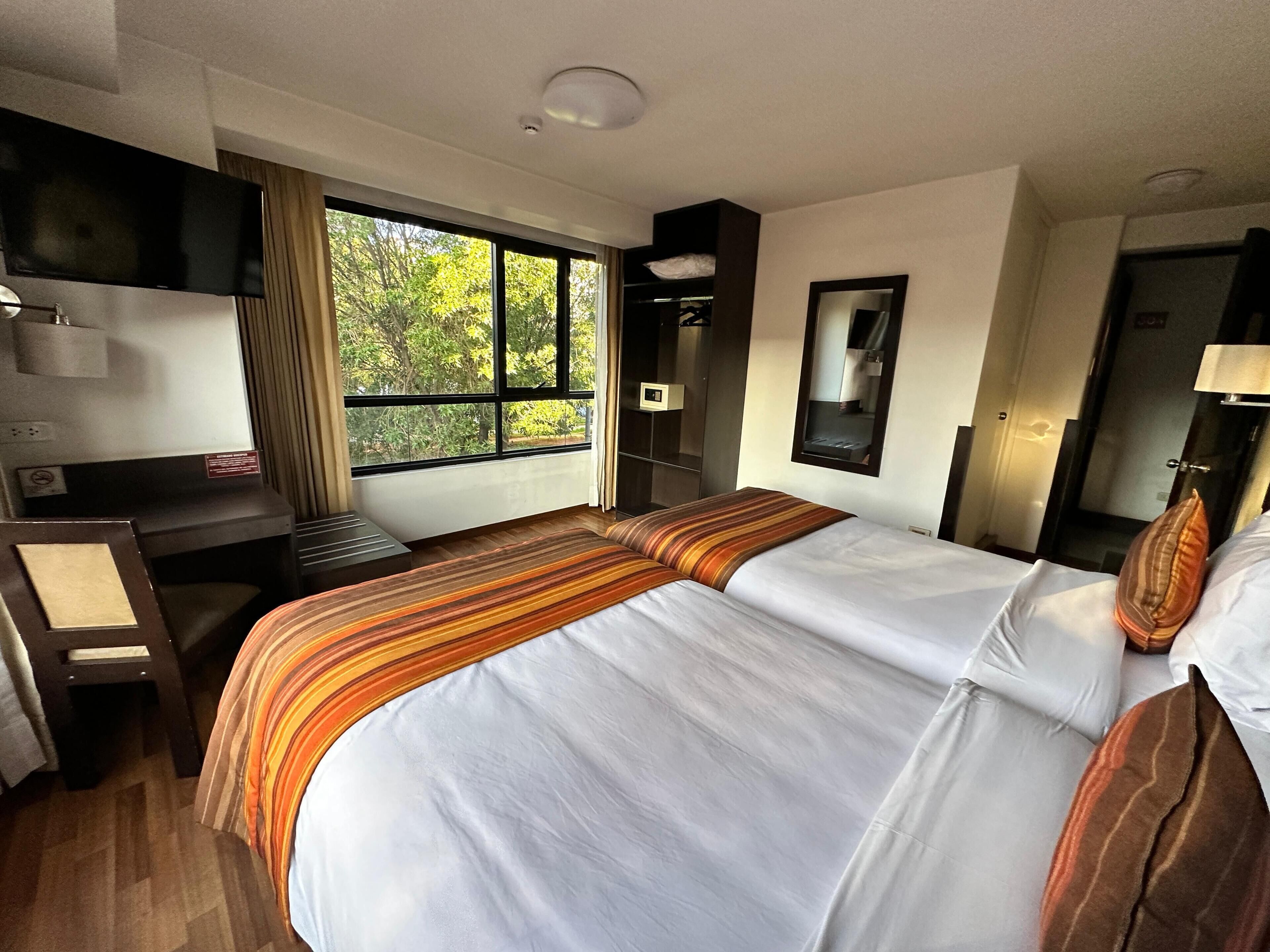 Premium bedding, down duvets, in-room safe, desk