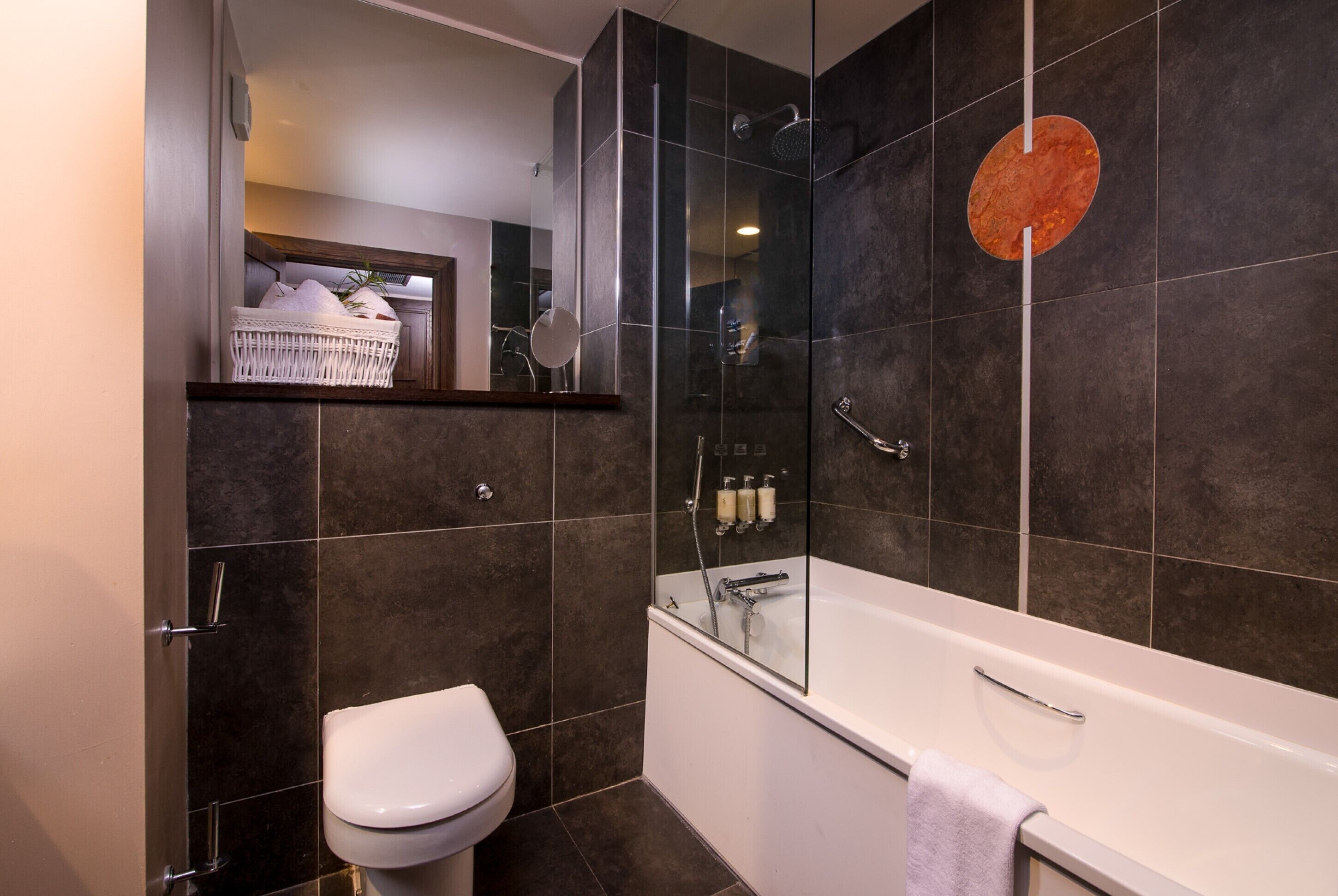 combined shower/bathtub, designer toiletries, hair dryer, bathrobes