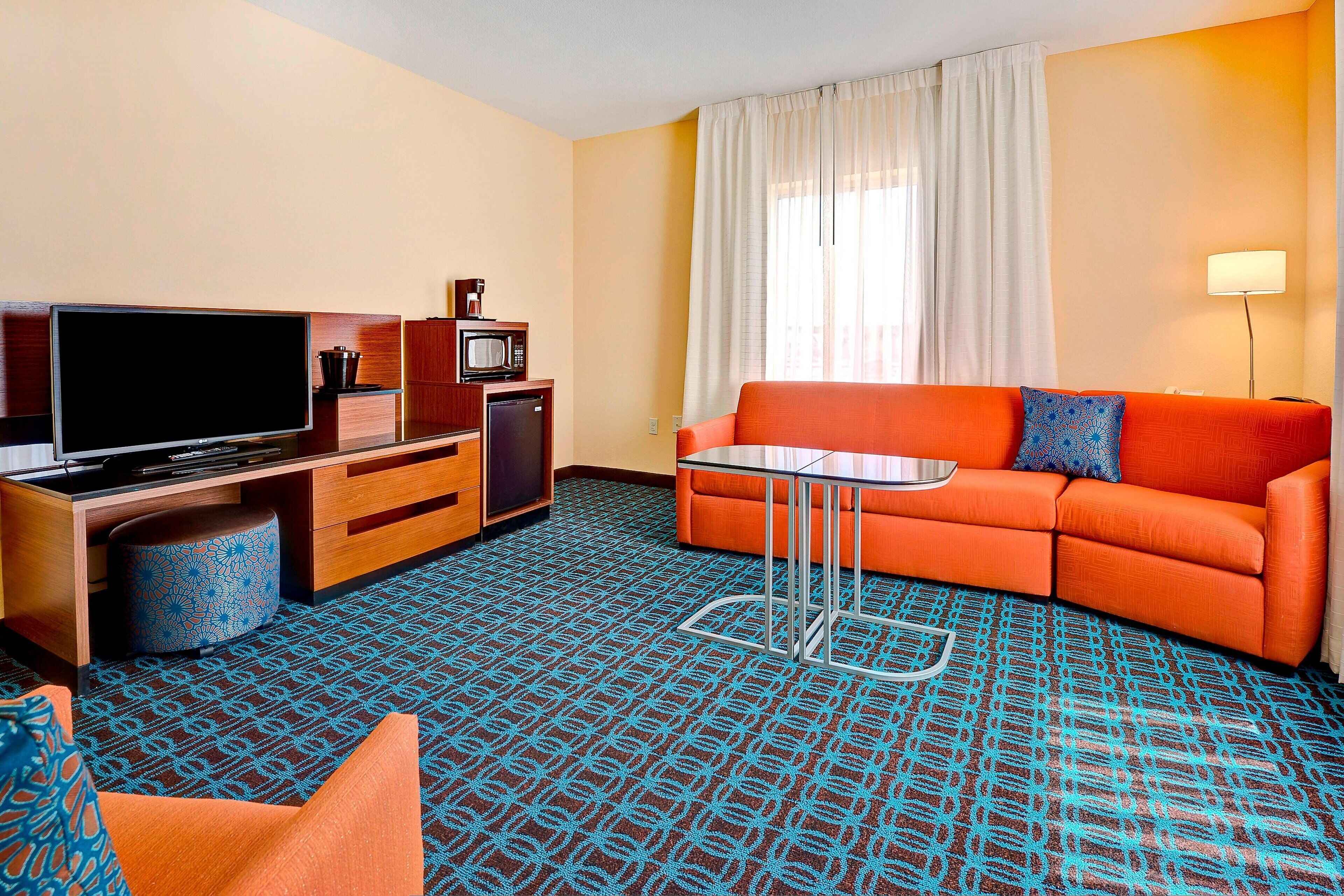 suite, 1 bedroom | living area | 30-inch lcd tv with cable channels, tv, pay films