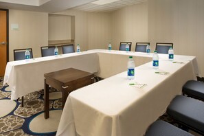 A conference room with a long table, chairs, and water bottles. - Holiday Inn El Paso Airport by IHG (El Paso)