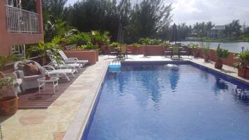 Outdoor pool, free cabanas, pool umbrellas