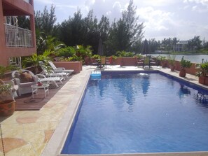 Outdoor pool, free pool cabanas, pool umbrellas