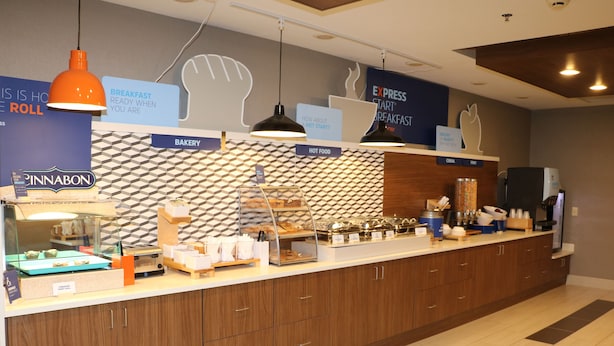 A breakfast area with a bakery, hot food, and express breakfast options. - Holiday Inn Express & Suites Douglas by IHG (Douglas)