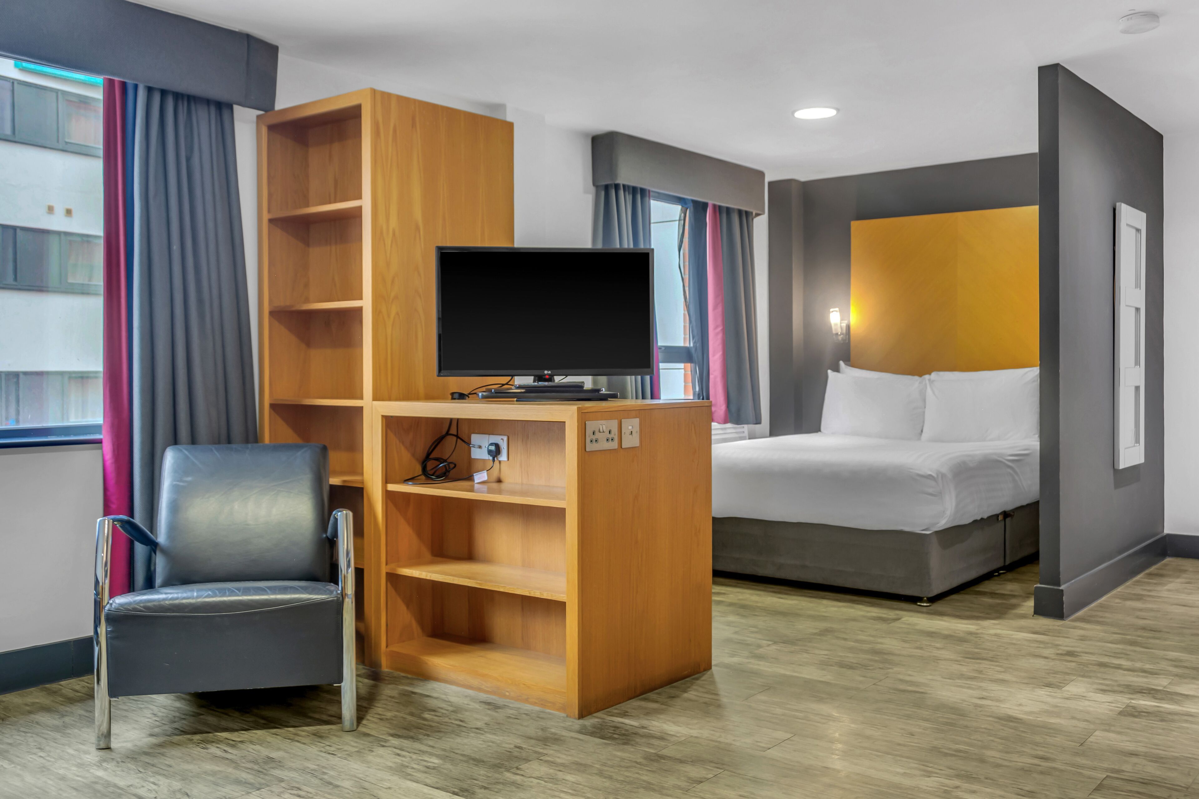 grande studio | living area | flat-screen tv