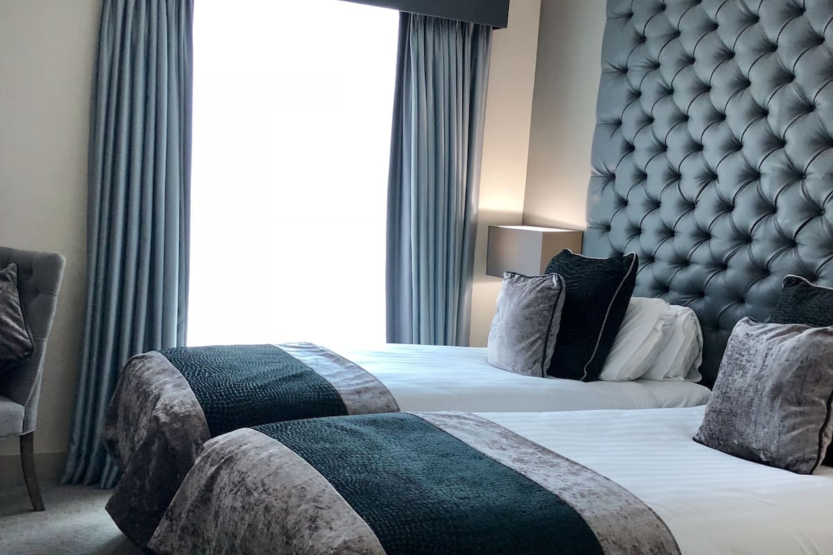 Superior Twin Room | In-room safe, desk, blackout drapes, iron/ironing board