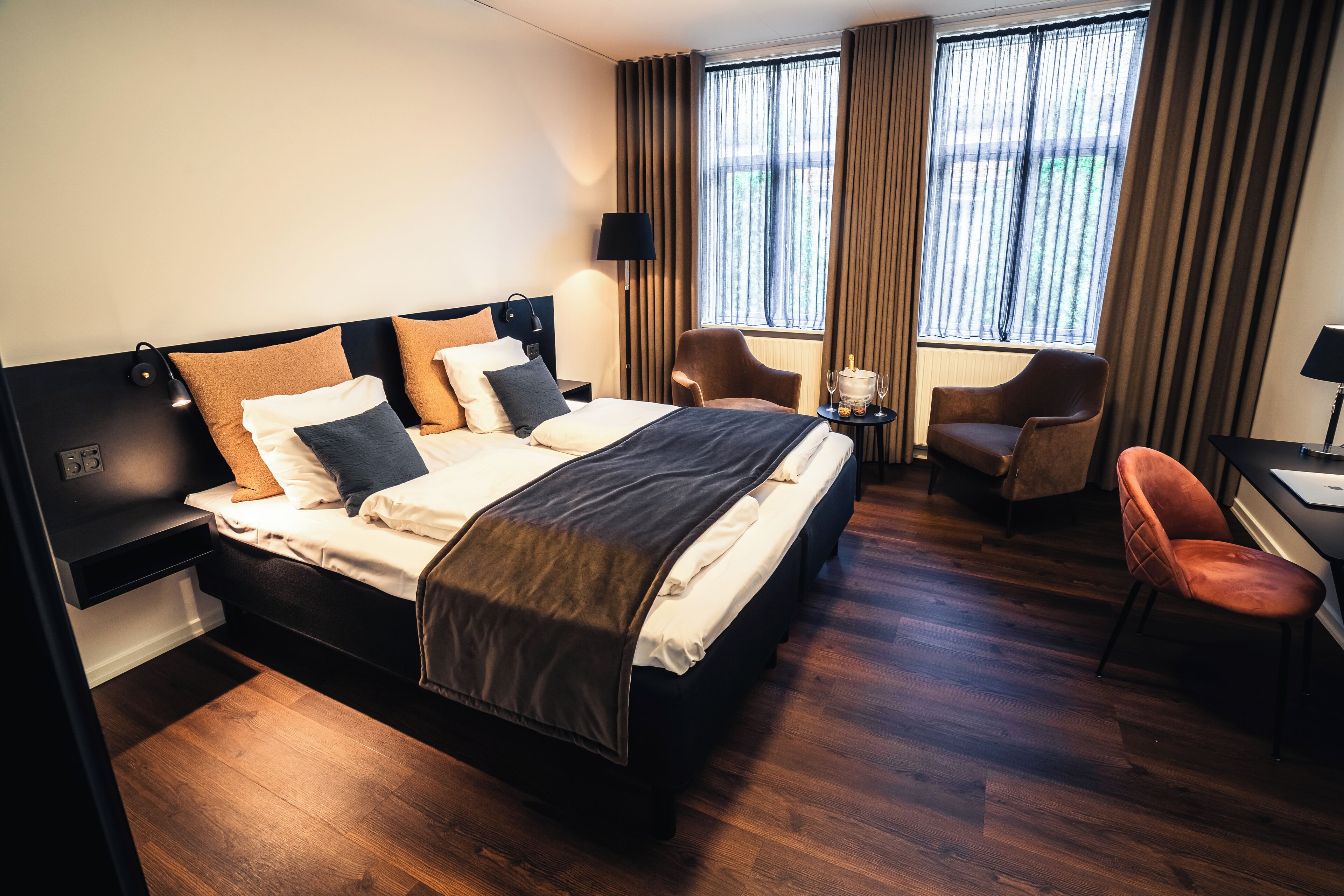 Grand Plus | Desk, laptop workspace, blackout drapes, iron/ironing board