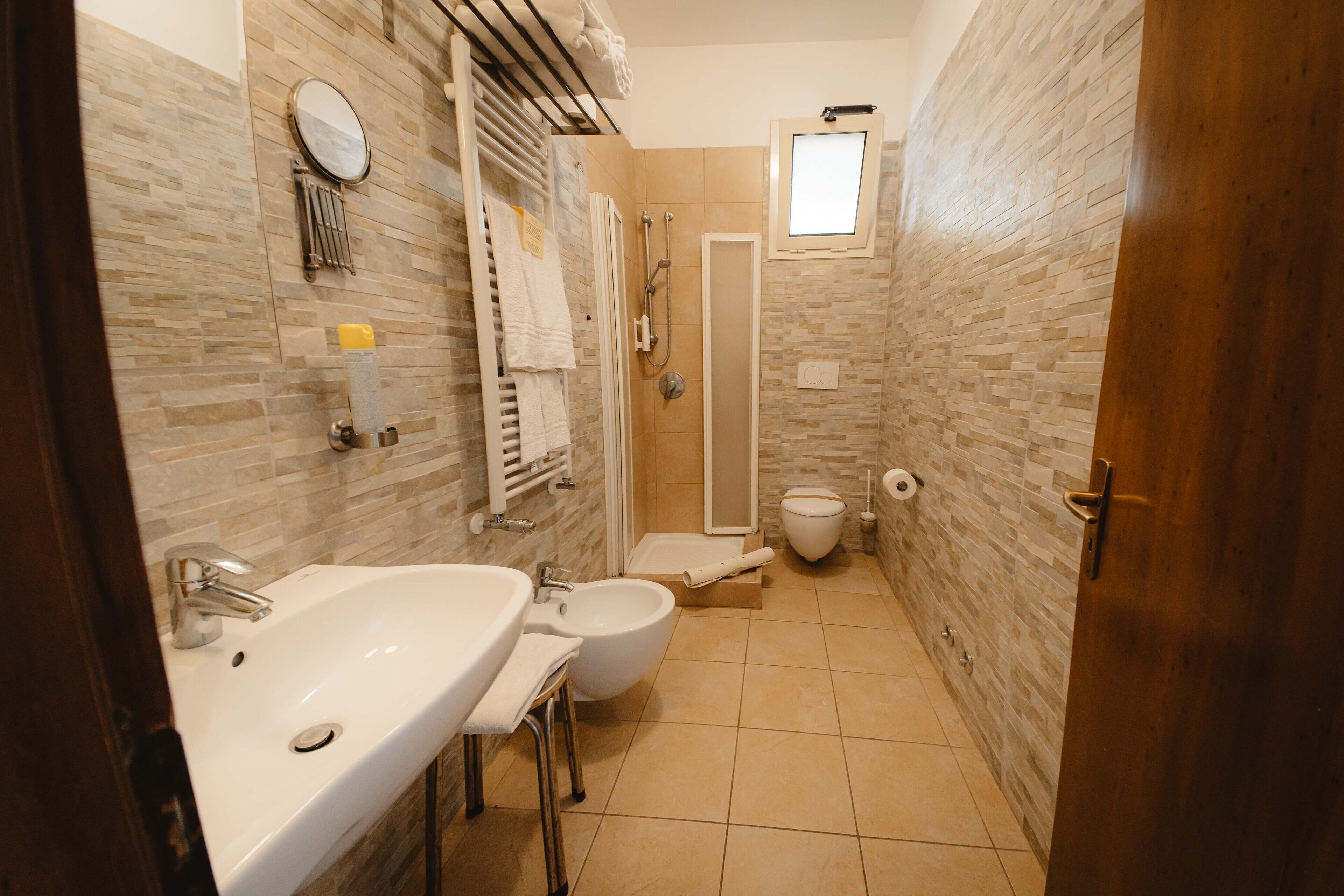 superior room | bathroom | shower, free toiletries, hair dryer, bidet
