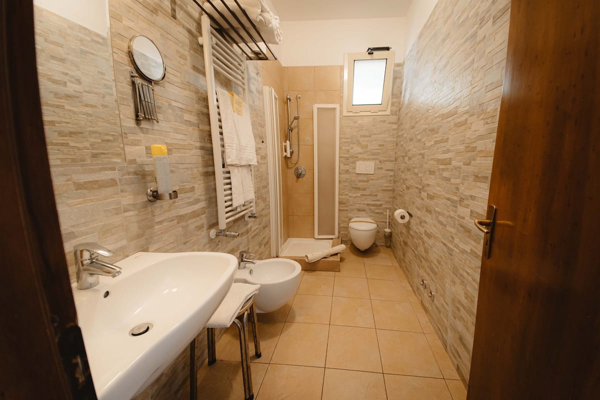 superior room | bathroom | shower, free toiletries, hair dryer, bidet