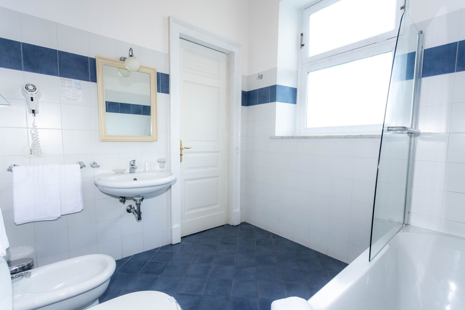 free toiletries, hair dryer, bidet, towels