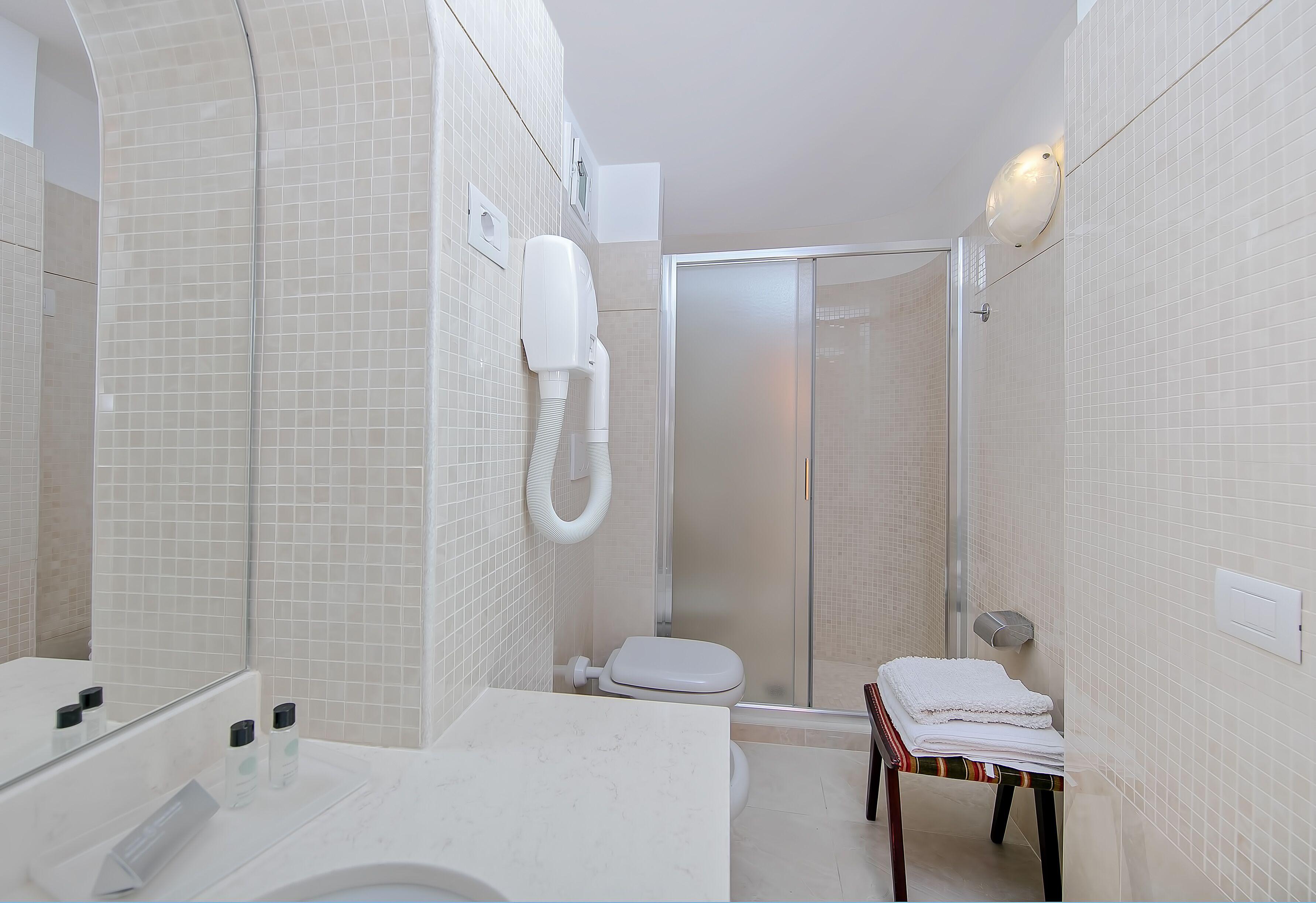 junior suite, balcony, sea view | bathroom | combined shower/bathtub, hair dryer, bidet, towels